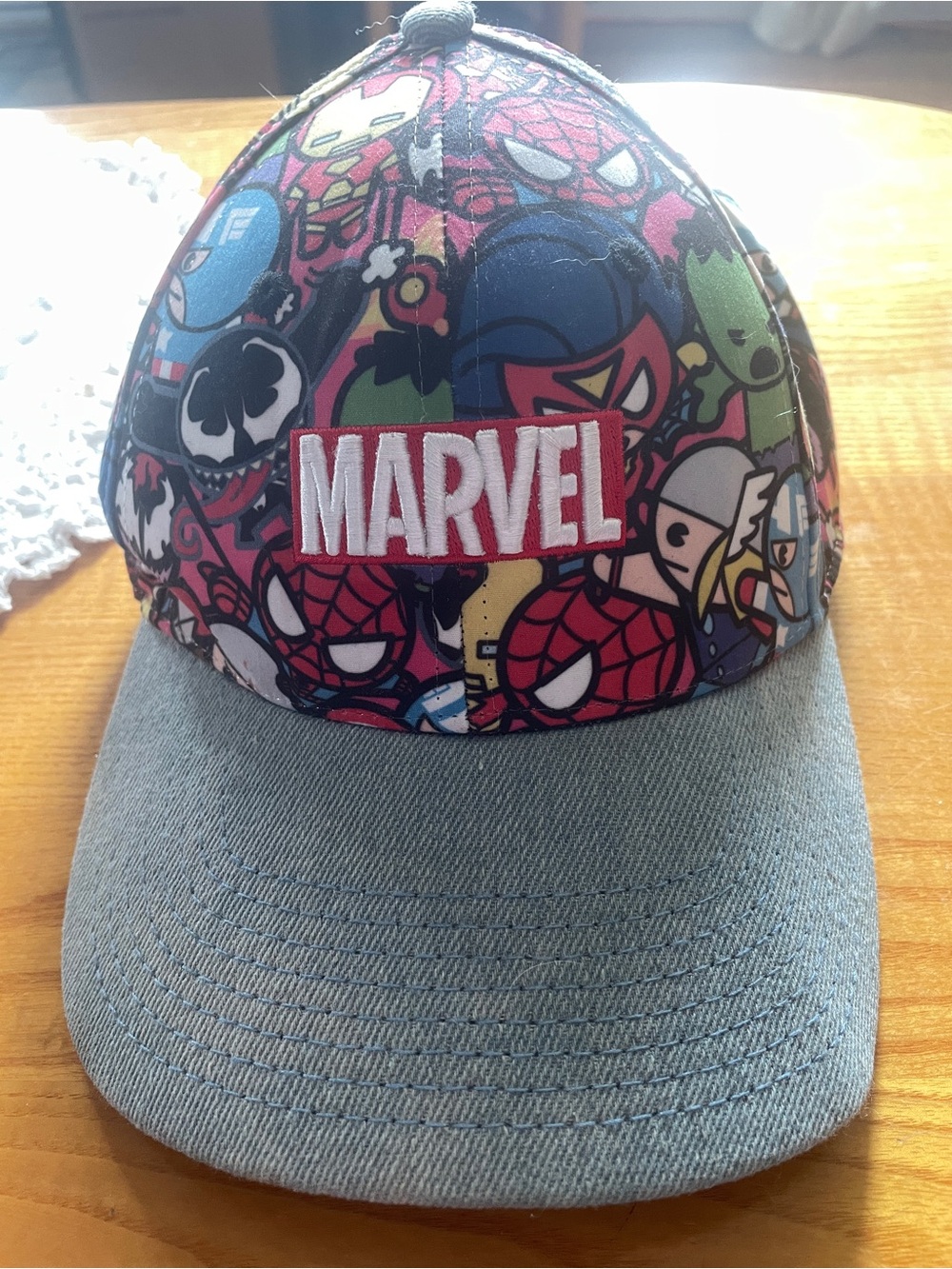 Marvel hat and sweatshirt.